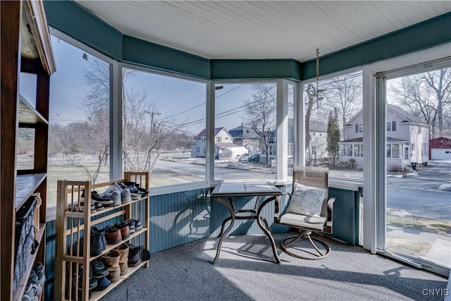 sunroom with a residential view