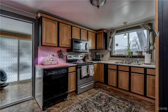 kitchen featuring a sink, brown cabinetry, stainless steel appliances, and light countertops