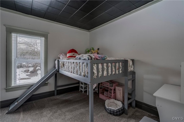 carpeted bedroom featuring baseboards