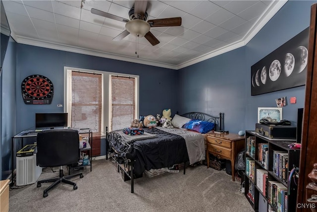 bedroom featuring carpet, a ceiling fan, and crown molding