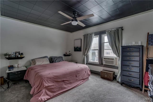 bedroom with cooling unit, carpet flooring, and a ceiling fan