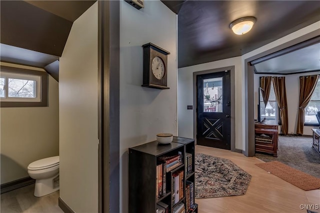 entryway featuring wood finished floors and baseboards