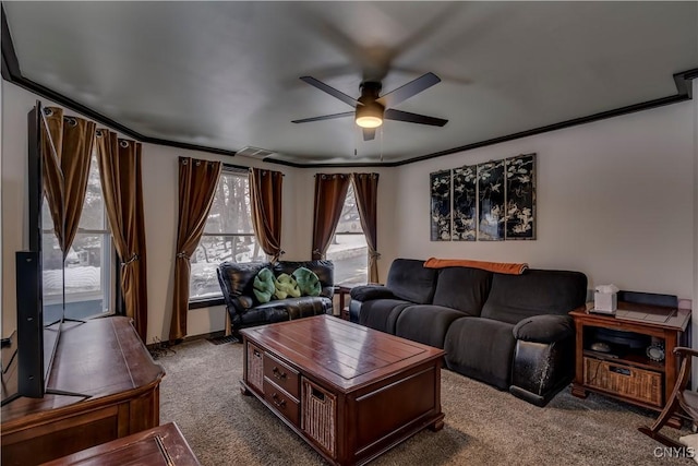 living room featuring carpet floors, a ceiling fan, and crown molding