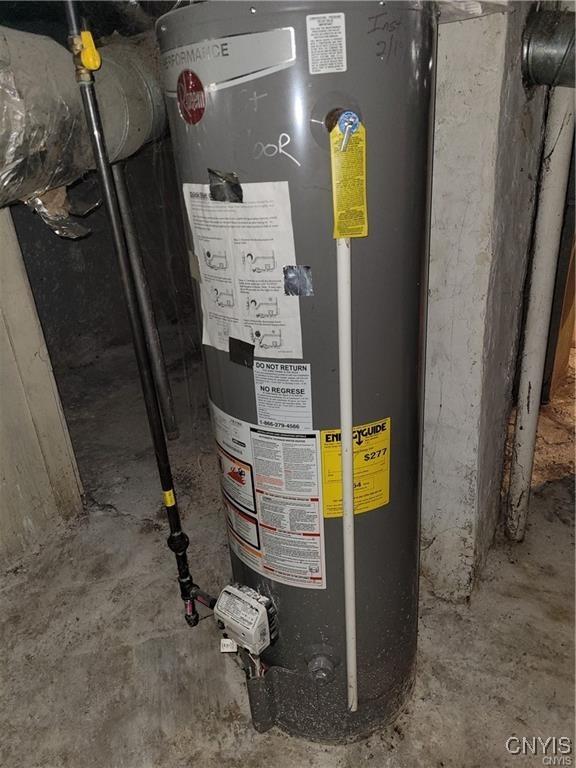 utility room featuring water heater