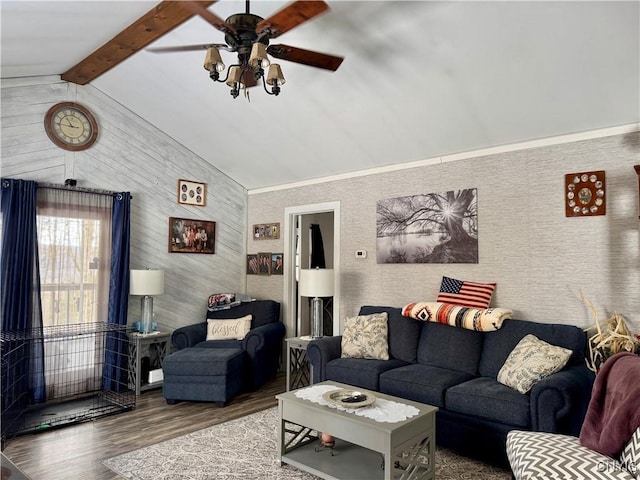 living room with ceiling fan, lofted ceiling with beams, and wood finished floors