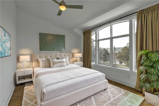 bedroom with lofted ceiling, ceiling fan, baseboards, and wood finished floors