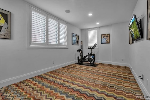 workout area with recessed lighting and baseboards