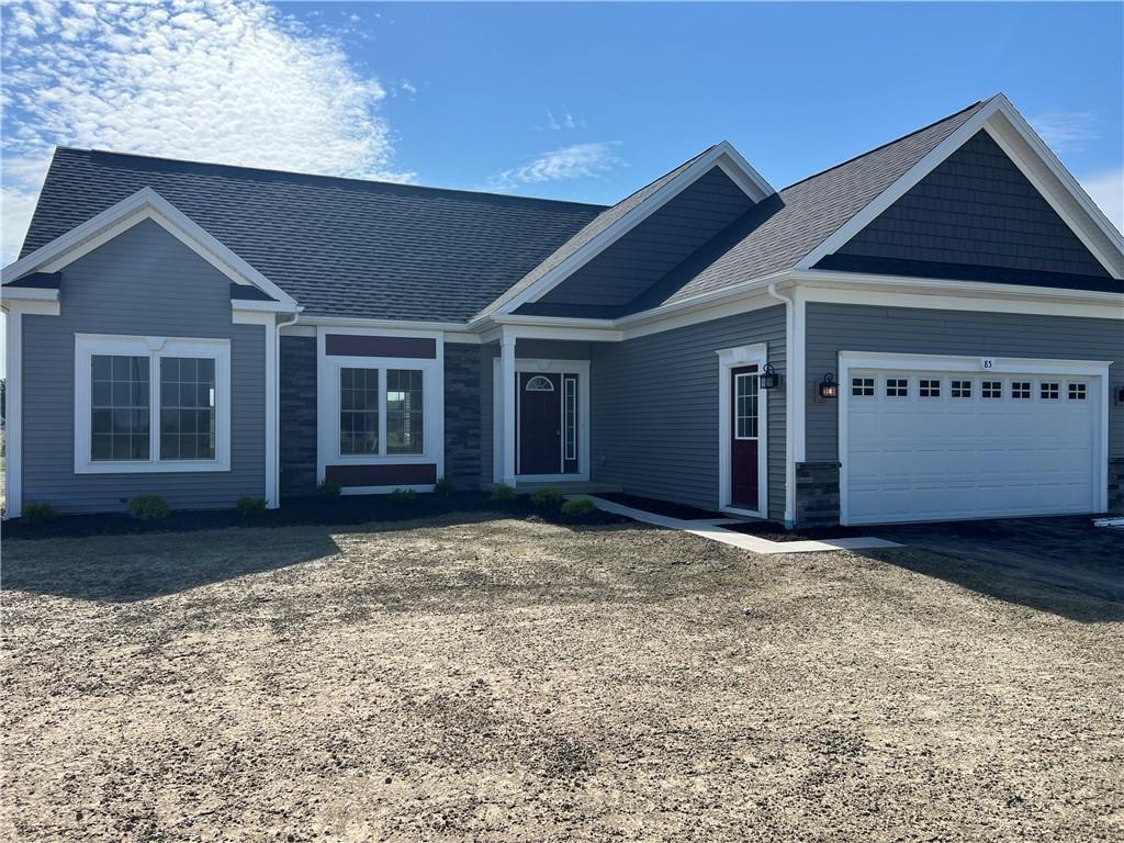 85 Steeplechase, Geneseo, NY 14454 - ranch-style home with a garage, stone siding, driveway, and roof with shingles