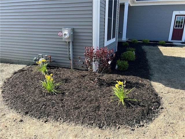 exterior details featuring electric meter and gas meter