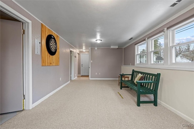 sitting room featuring carpet flooring, visible vents, and baseboards