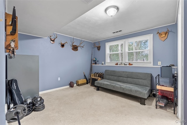 living area with carpet floors, baseboards, visible vents, and ornamental molding