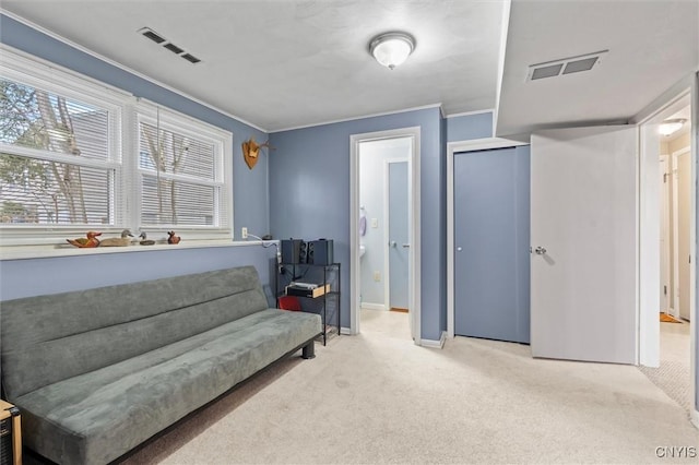 living area featuring baseboards, carpet flooring, visible vents, and crown molding