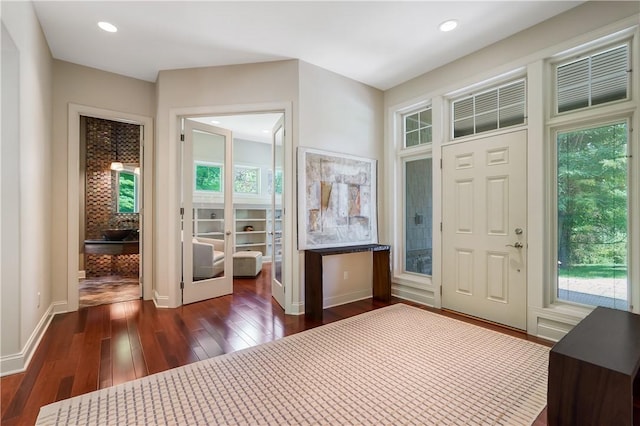 entrance foyer featuring baseboards, dark wood-style flooring, and recessed lighting