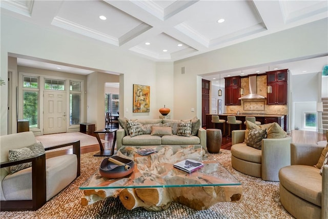 living area featuring light wood-style flooring, coffered ceiling, beamed ceiling, and recessed lighting