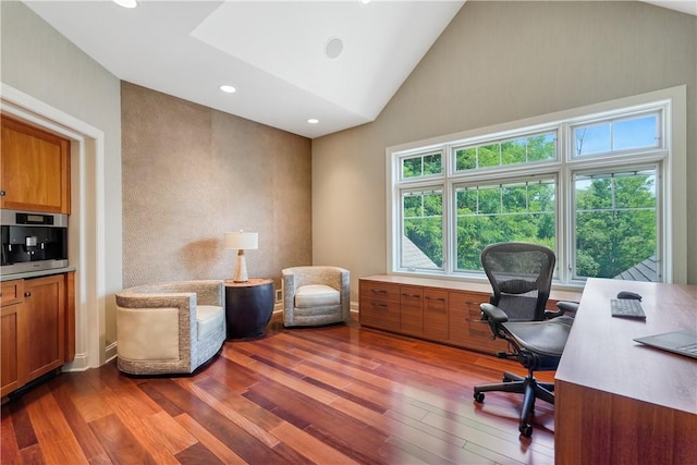 office area with high vaulted ceiling, wood finished floors, and recessed lighting