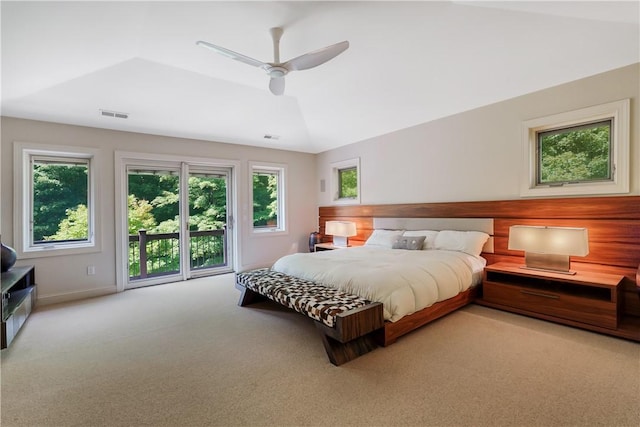 bedroom with carpet floors, ceiling fan, visible vents, and vaulted ceiling