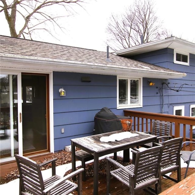 wooden deck with outdoor dining area