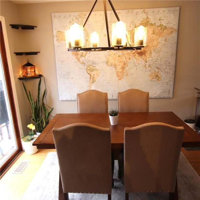 dining room featuring visible vents