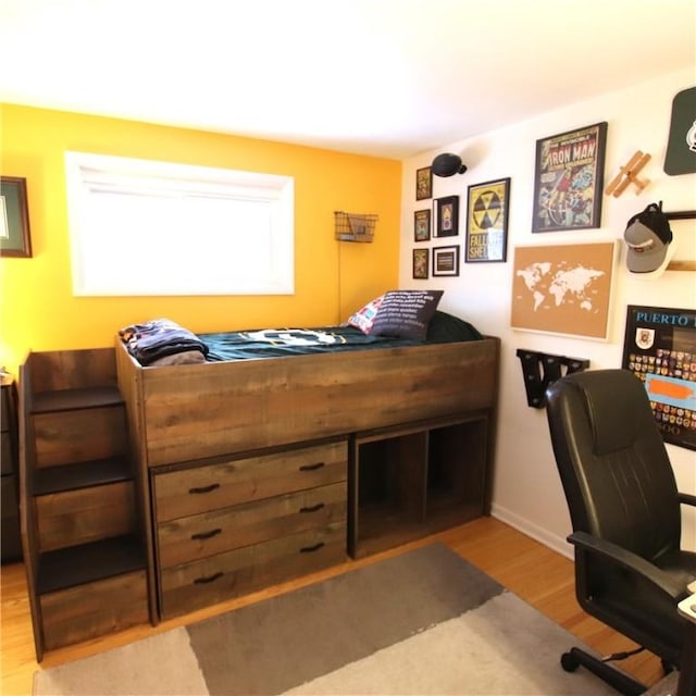 bedroom with light wood finished floors