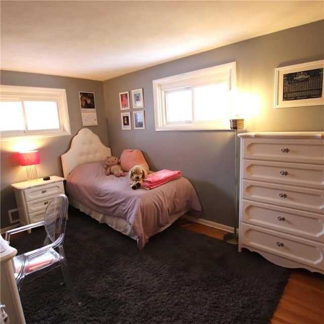 bedroom featuring dark wood-type flooring