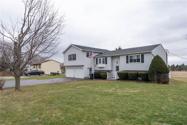 view of front of property featuring aphalt driveway, an attached garage, and a front lawn