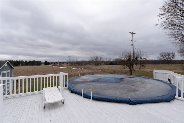 wooden terrace featuring a covered pool