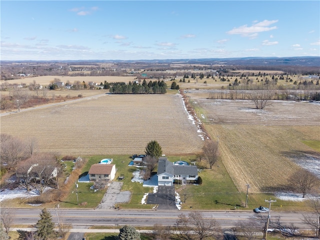 birds eye view of property featuring a rural view