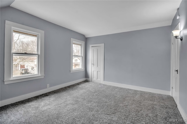 192 Cottage St, Lockport-City, NY 14094 - unfurnished room with vaulted ceiling, carpet flooring, and baseboards