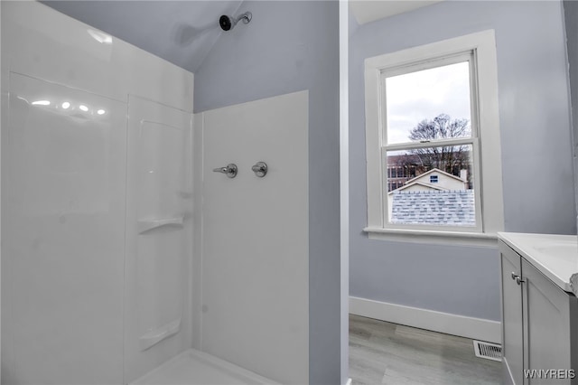 192 Cottage St, Lockport-City, NY 14094 - full bathroom featuring visible vents, walk in shower, vanity, and baseboards