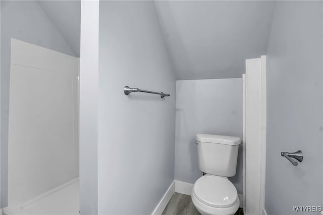 192 Cottage St, Lockport-City, NY 14094 - bathroom with baseboards, toilet, wood finished floors, walk in shower, and vaulted ceiling