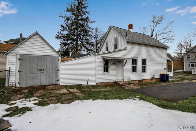 192 Cottage St, Lockport-City, NY 14094 - exterior space with a storage unit, a chimney, and an outdoor structure