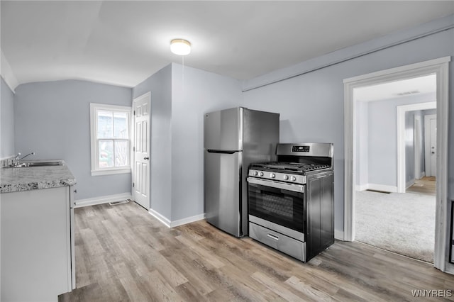 192 Cottage St, Lockport-City, NY 14094 - kitchen featuring appliances with stainless steel finishes, light wood-style floors, and baseboards
