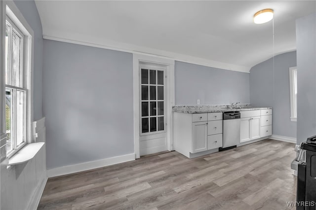 192 Cottage St, Lockport-City, NY 14094 - kitchen featuring light stone counters, stainless steel appliances, light wood-style flooring, white cabinetry, and baseboards