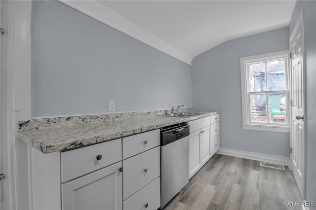 192 Cottage St, Lockport-City, NY 14094 - kitchen with light wood finished floors, visible vents, stainless steel dishwasher, white cabinetry, and vaulted ceiling