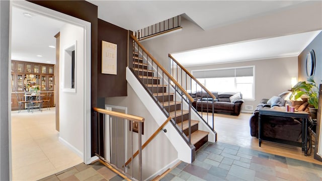 stairs featuring baseboards