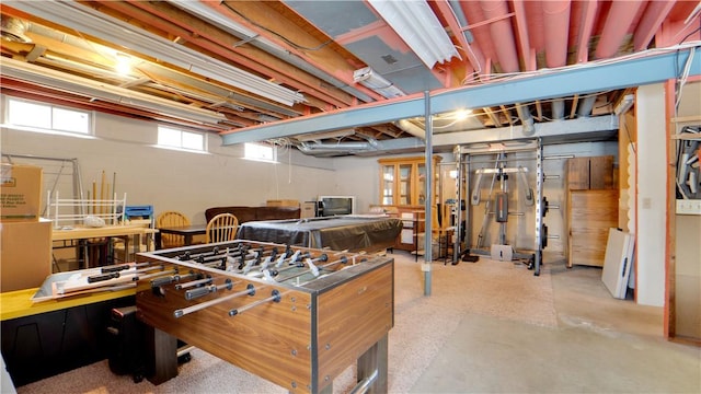 game room featuring concrete flooring