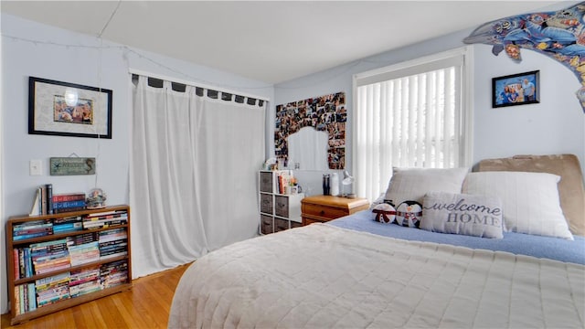 bedroom featuring a closet and wood finished floors