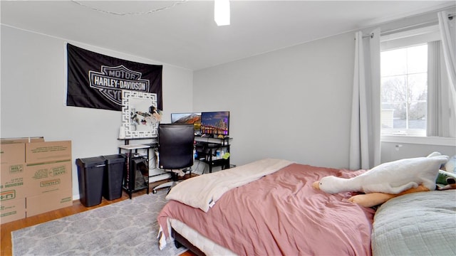 bedroom with wood finished floors