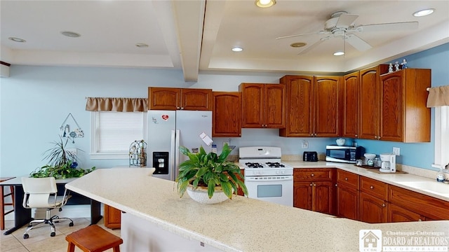 kitchen with a sink, stainless steel appliances, light countertops, and recessed lighting