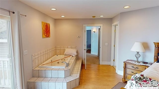 bedroom featuring recessed lighting, light wood-style flooring, and baseboards