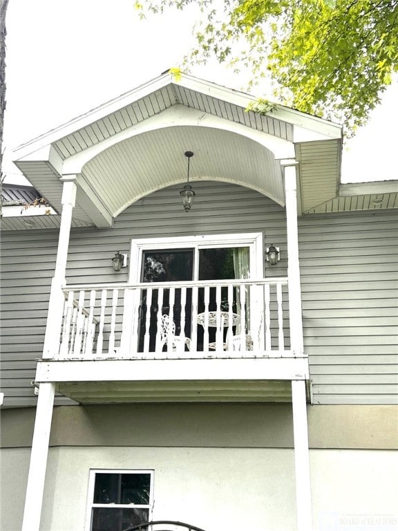 view of property exterior with a balcony