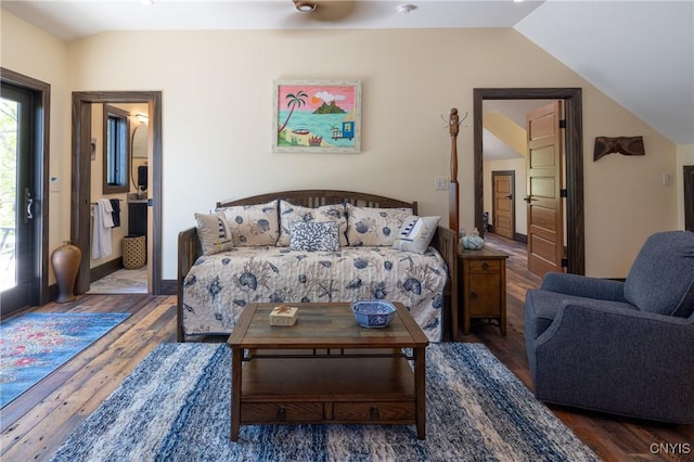 living room featuring lofted ceiling and wood finished floors