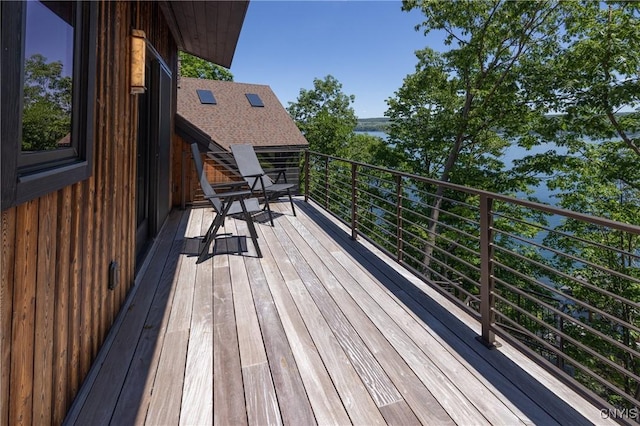 wooden deck featuring a water view