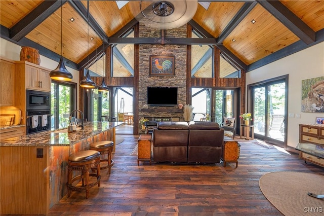 living room featuring dark wood-style floors, wood ceiling, and beam ceiling