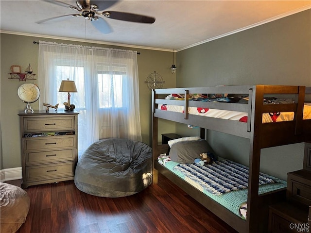 bedroom featuring ceiling fan, crown molding, and wood finished floors