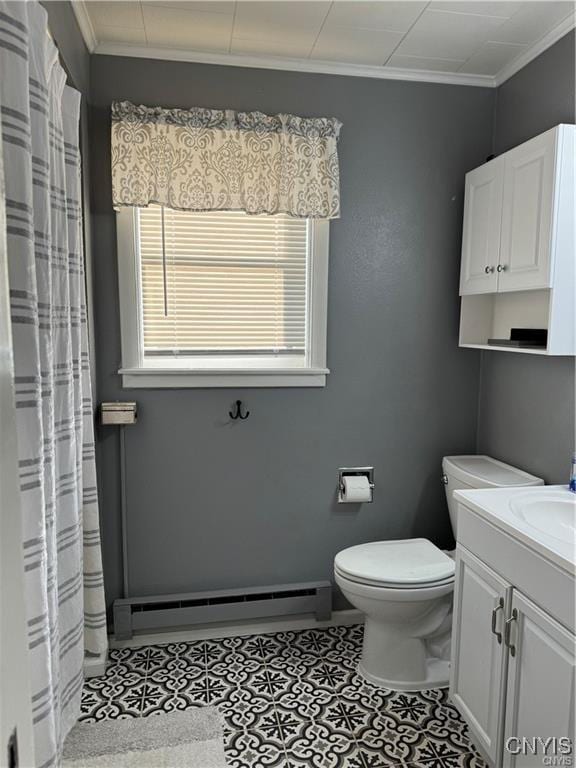 bathroom featuring toilet, a baseboard heating unit, vanity, ornamental molding, and tile patterned floors