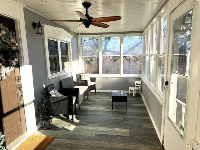 sunroom with wooden ceiling and ceiling fan