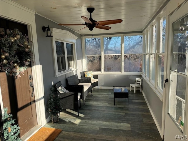 sunroom with wooden ceiling and ceiling fan