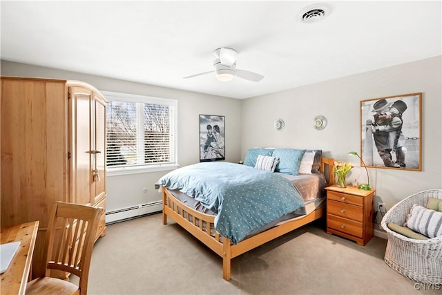 bedroom featuring a baseboard heating unit, ceiling fan, light carpet, and visible vents