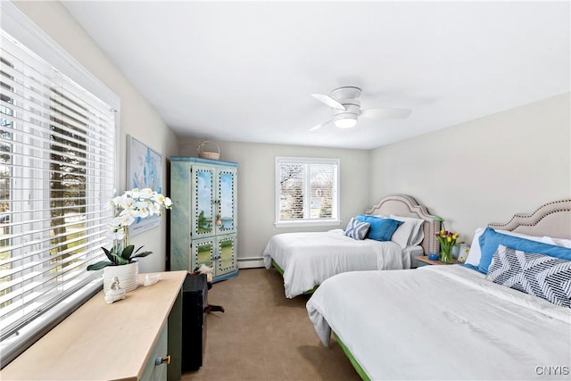 carpeted bedroom featuring a ceiling fan and a baseboard radiator